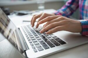 person typing cornerstone content